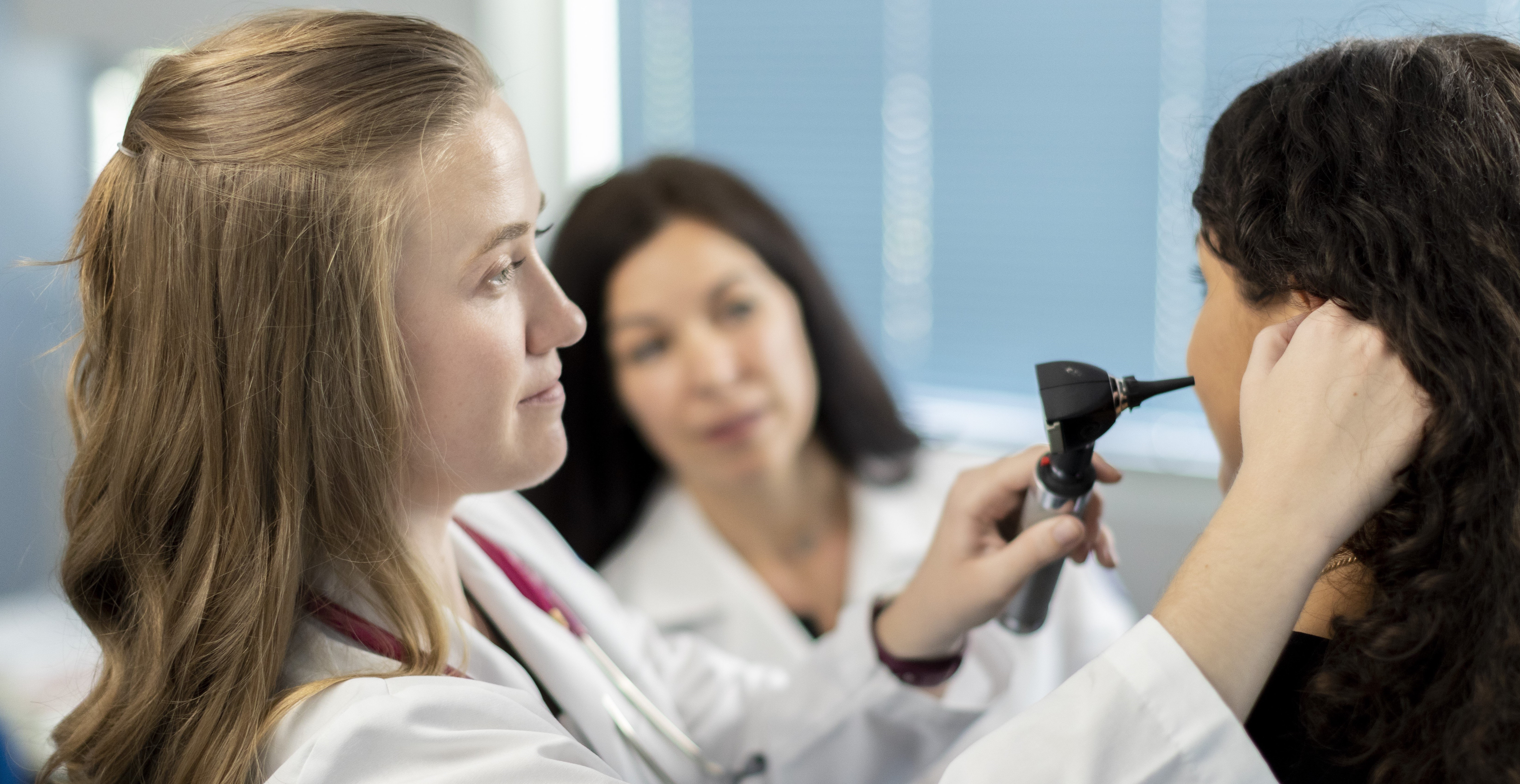 Physician Assistant student works with patient